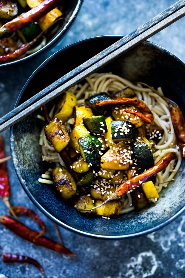 A simple delicious recipe for Kung Pao Zucchini over noodles or rice. Vegan and gluten-free adaptable! | www.feastingathome.com 