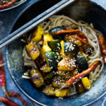 A simple delicious recipe for Kung Pao Zucchini over noodles or rice. Vegan and gluten-free adaptable! | www.feastingathome.com