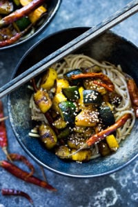 A simple delicious recipe for Kung Pao Zucchini over noodles or rice. Vegan and gluten-free adaptable! | www.feastingathome.com