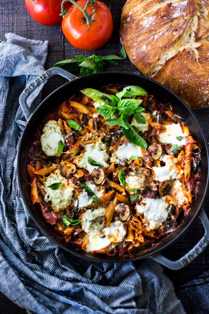 A simple, flavorful no-boil, Mushroom Baked Ziti with Spinach and Ricotta ( or sub tofu ricotta) that can be made in one pan and requires no pre-boiling of pasta. Perfect for weeknight dinners! #noboil, #ziti, #vegan | www.feastingathome.com