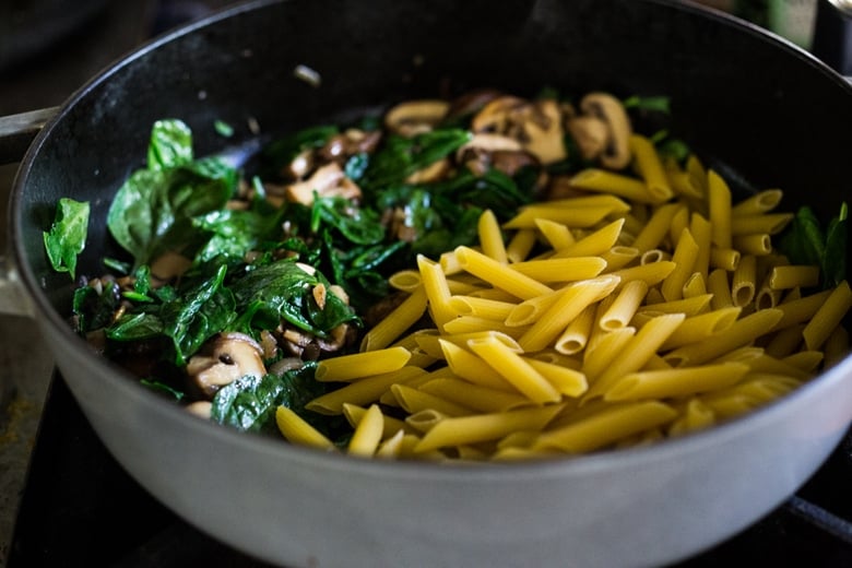 A simple, flavorful no-boil, Mushroom Baked Ziti with Spinach and Ricotta ( or sub tofu ricotta) that can be made in one pan and requires no pre-boiling of pasta. Perfect for weeknight dinners! #noboil, #ziti, #vegan | www.feastingathome.com