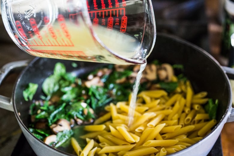 A simple, flavorful no-boil, Mushroom Baked Ziti with Spinach and Ricotta ( or sub tofu ricotta) that can be made in one pan and requires no pre-boiling of pasta. Perfect for weeknight dinners! #noboil, #ziti, #vegan | www.feastingathome.com