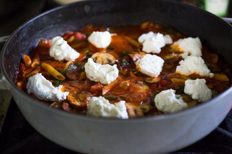 A simple, flavorful no-boil, Mushroom Baked Ziti with Spinach and Ricotta ( or sub tofu ricotta) that can be made in one pan and requires no pre-boiling of pasta. Perfect for weeknight dinners! #noboil, #ziti, #vegan | www.feastingathome.com