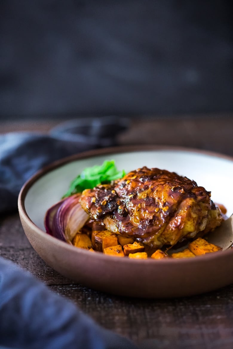 Sheet-Pan Harissa Chicken and roasted Sweet Potatoes- just 15 minutes of hands on time, before baking in the oven. Smoky, earthy, fragrant, North African Spices ! #harissa #harissachicken #chicken # sheetpandinner | www.feastingathome.com