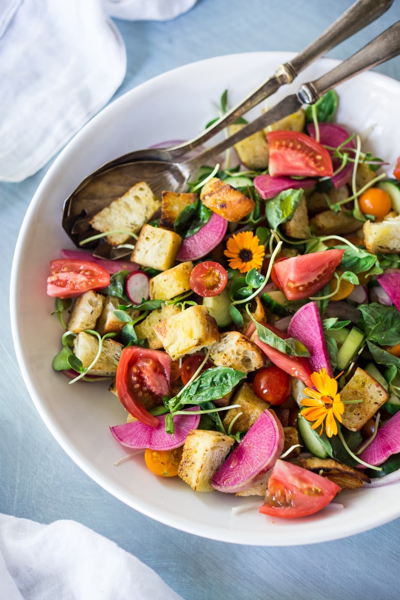 The BEST EVER Summer Panzanella Salad with Garlicky Croutons, bursting with fresh seasonal summer ingredients and FLAVOR! | www.feastingathome.com