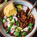 Our favorite Vegan Chili -full of depth and flavor and loaded up with healthy veggies. #veganchili