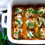 Zucchini Lasagna Roll Ups with Spinach and Basil, baked in marinara sauce, a healthy, low-carb, vegan adaptable recipe! #zucchini #zucchinirollups #zucchinirolls #zucchinilasagna #lowcarb #zucchinilasagna #zucchinirecipes www.feastingathome.com