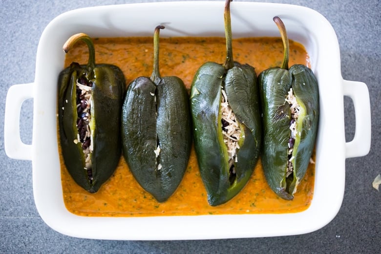 Roasted Black bean Chile Rellenos Recipe- a healthy lightened up version that is roasted instead of fried and is gluten free and vegan adaptable! | www.feastingathome.com