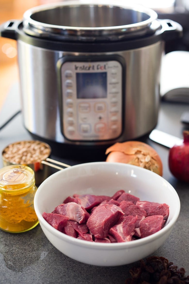 Instant Pot Middle Eastern Lamb Stew with chickpeas and fragrant spices- a simple flavorful wholesome meal. Serve over quinoa, basmati rice or cauliflower "rice". | www.feastingathome.com