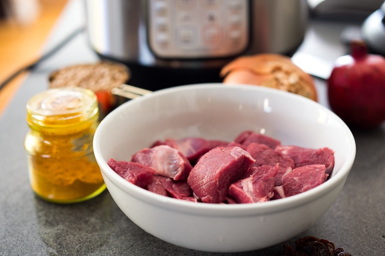 Instant Pot Middle Eastern Lamb Stew with chickpeas and fragrant spices- a simple flavorful wholesome meal. Serve over quinoa, basmati rice or cauliflower "rice". | #americanlamb