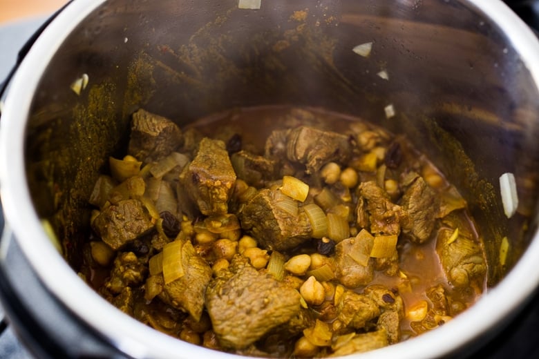 Instant Pot Middle Eastern Lamb Stew with chickpeas and fragrant spices- a simple flavorful wholesome meal. Serve over quinoa, basmati rice or cauliflower "rice". | www.feastingathome.com