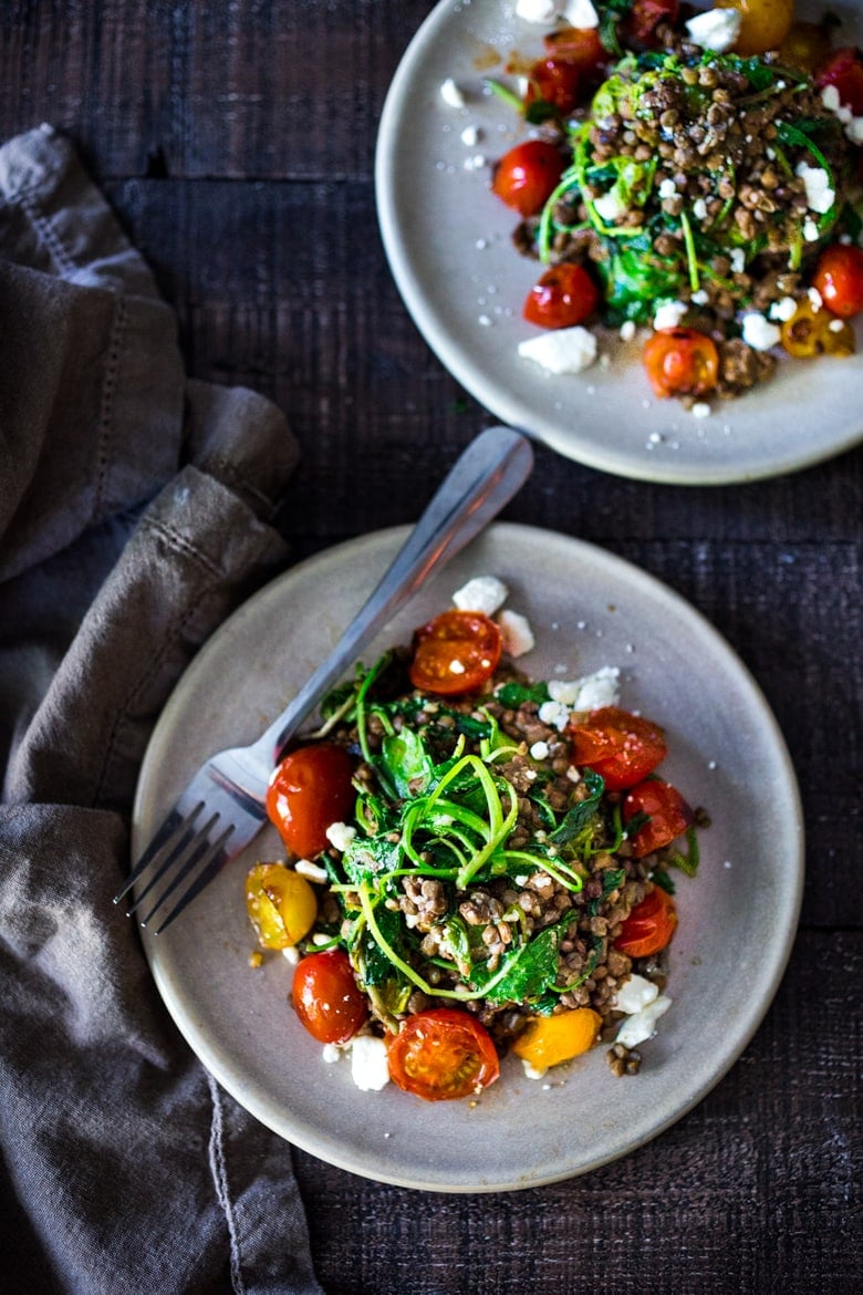  Lentils with Blistered Tomatoes and Kale- a simple vegetarian lentil recipe seasoned with Middle Eastern spices & topped with feta. Healthy, tasty! | www.feastingathome.com #halfcuphabit #lentilrecipes #vegetarianlentils 