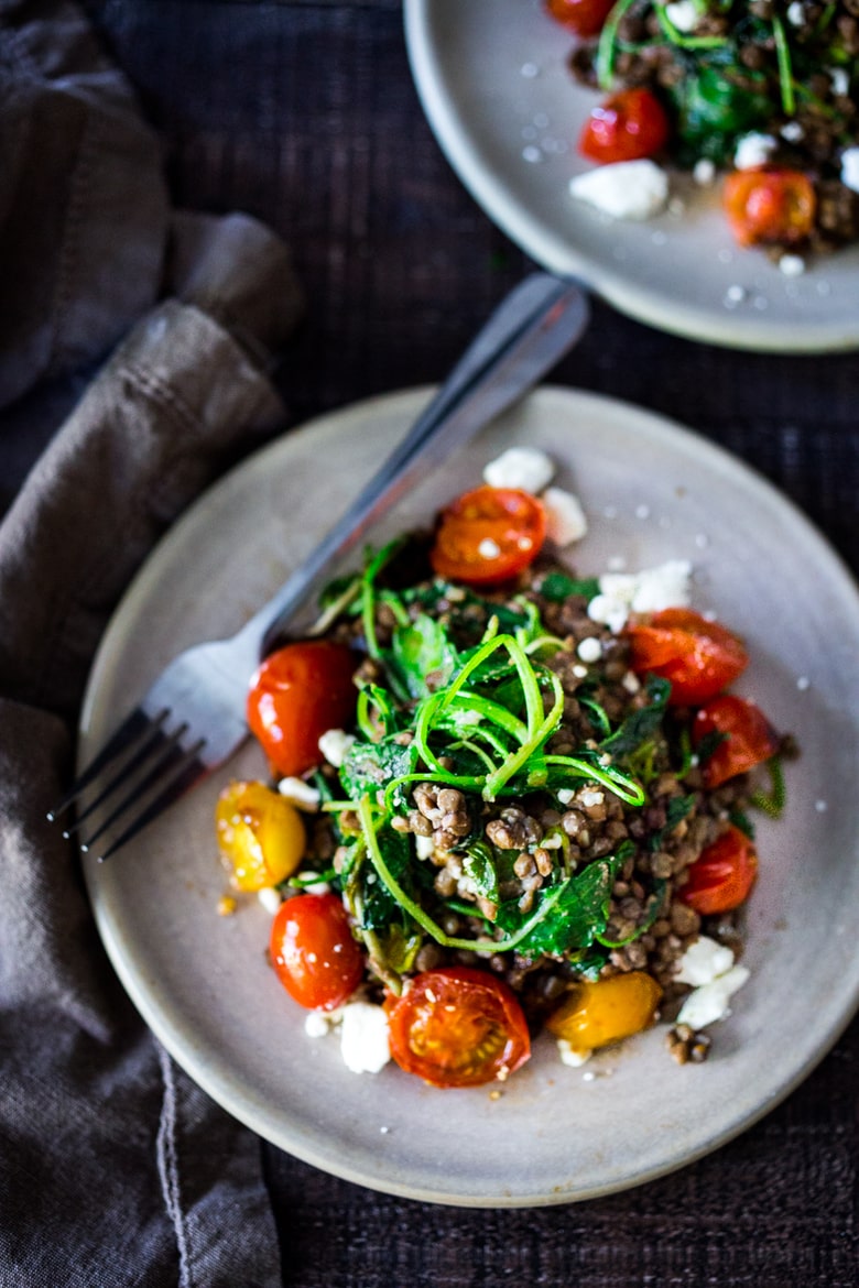  Lentils with Blistered Tomatoes and Kale- a simple vegetarian lentil recipe seasoned with Middle Eastern spices & topped with feta. Healthy, tasty! | www.feastingathome.com #halfcuphabit #lentilrecipes #justaddpulses