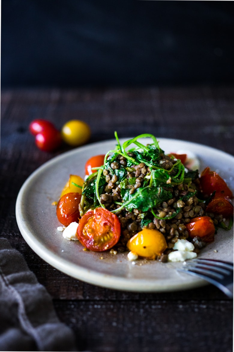  Lentils with Blistered Tomatoes and Kale- a simple vegetarian lentil recipe seasoned with Middle Eastern spices & topped with feta. Healthy, tasty! | www.feastingathome.com #halfcuphabit #lentilrecipes #justaddpulses