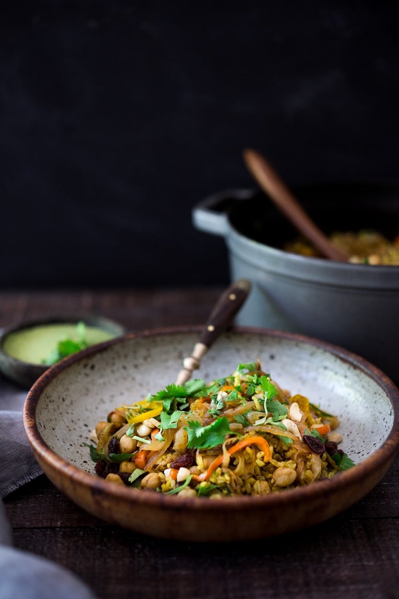 Quick and Easy Vegetarian Biryani! A fragrant Indian rice dish infused with Indian spices - vegan adaptable and gluten-free. A quick and easy weeknight meal. | www.feastingathome.com #biryani #vegandinner #veganrecipe #vegetablebiryani #veganbiryani 