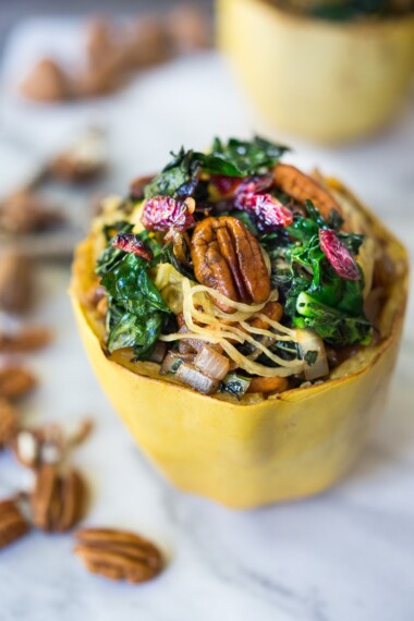 Stuffed Spaghetti Squash with Pecans, Kale and Dried Cranberries, a simple delicious weeknight meal. Vegan & GF | www.feastingathome.com