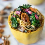 Roasted Spaghetti Squash stuffed with Pecans, Kale and Dried Cranberries, a simple delicious weeknight meal. Vegan & GF