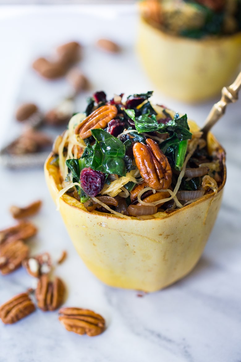  Stuffed Spaghetti Squash with Pecans, Kale and Dried Cranberries, a simple delicious weeknight meal. Vegan & GF | www.feastingathome.com