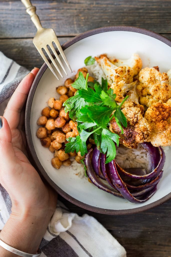 Chickpea Bowl with sheet-pan roasted cauliflower, spiced chickpeas and optional chicken, served over cinnamon-scented rice. A FAST, flavorful weeknight meal!