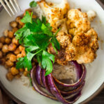 Tandoori Glory Bowl with sheet-pan roasted cauliflower, chickpeas and optional chicken, served over cinnamon scented rice. A FAST, flavorful weeknight meal! Vegan, GF | www.feastingathome.com