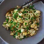 This roasted Cauliflower Pasta recipe is easy to make and completely delicious! It's made with toasted walnuts, garlic, fresh herbs and lemon zest. Video.