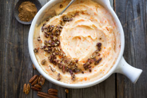 Creamy Carrot Mashed Potatoes with brown butter pecans. | www.feastingathome.com