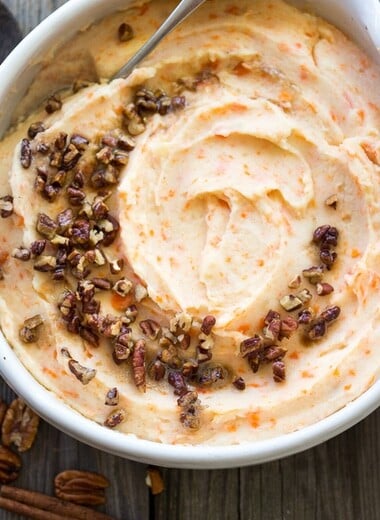 Creamy Carrot Mashed Potatoes with brown butter pecans. | www.feastingathome.com