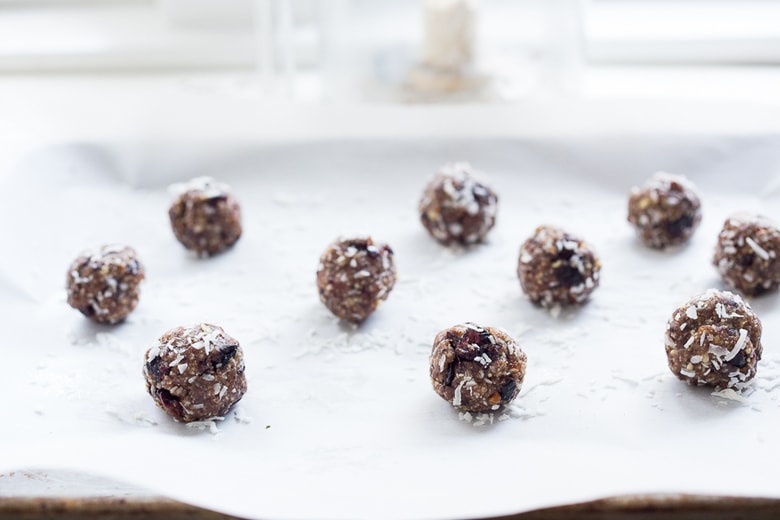 Coconut Pecan Energy Balls with Masala Spice and Dried Cranberries, a simple, tasty vegan and gluten-free snack that can be made in 10 minutes! | www.feastingathome.com