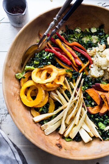 A Roasted Fall Vegetable Salad with roasted Delicata squash, parsnips, sweet potatoes dressed with a delicious Maple Curry Vinaigrette on a bed of shredded kale and brussel sprouts. Vegan and GF. #fallsalad #fallside #thanksgivingrecipes
