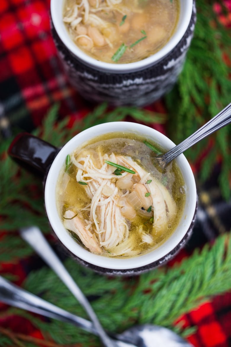 Instant Pot Chicken and White Bean Soup with dried beans and fresh herbs - a hearty, delicious soup that is fast, convenient and affordable! | www.feastingathome.com #instantpotchickenrecipes #instantpot #instantpotrecipes #instantpotchicken