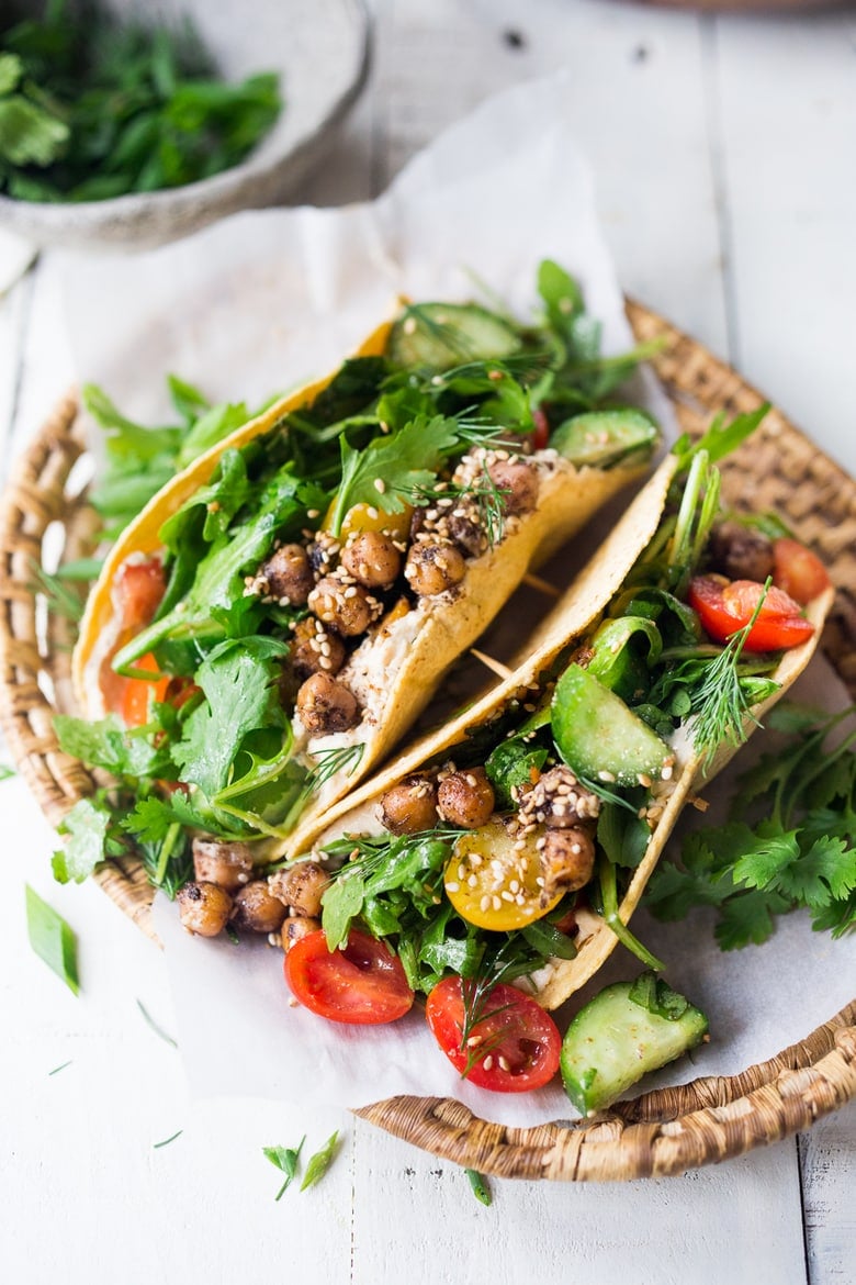 Simple, delicious Middle Eastern Salad Tacos with chickpeas, hummus and a mound of lemony greens, tomatoes & cucumber with fresh herbs. Vegan, GF! 