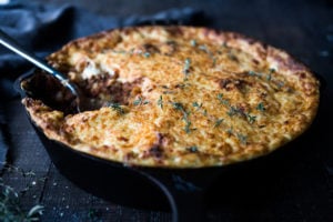 Simple authentic Greek baked pasta dish with a rich flavorful lamb (or beef) bolognese infused with Greek spices and flavors. Perfect for entertaining!