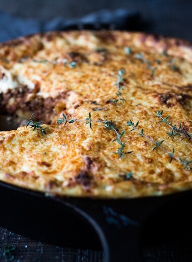 Simple authentic Greek baked pasta dish with a rich flavorful lamb (or beef) bolognese infused with Greek spices and flavors. Perfect for entertaining!