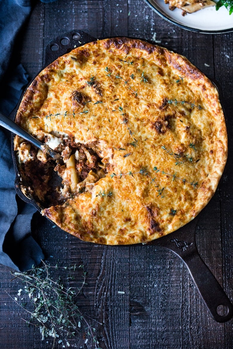 Simple authentic Greek baked pasta dish with a rich flavorful lamb (or beef) bolognese infused with Greek spices and flavors. Perfect for entertaining!