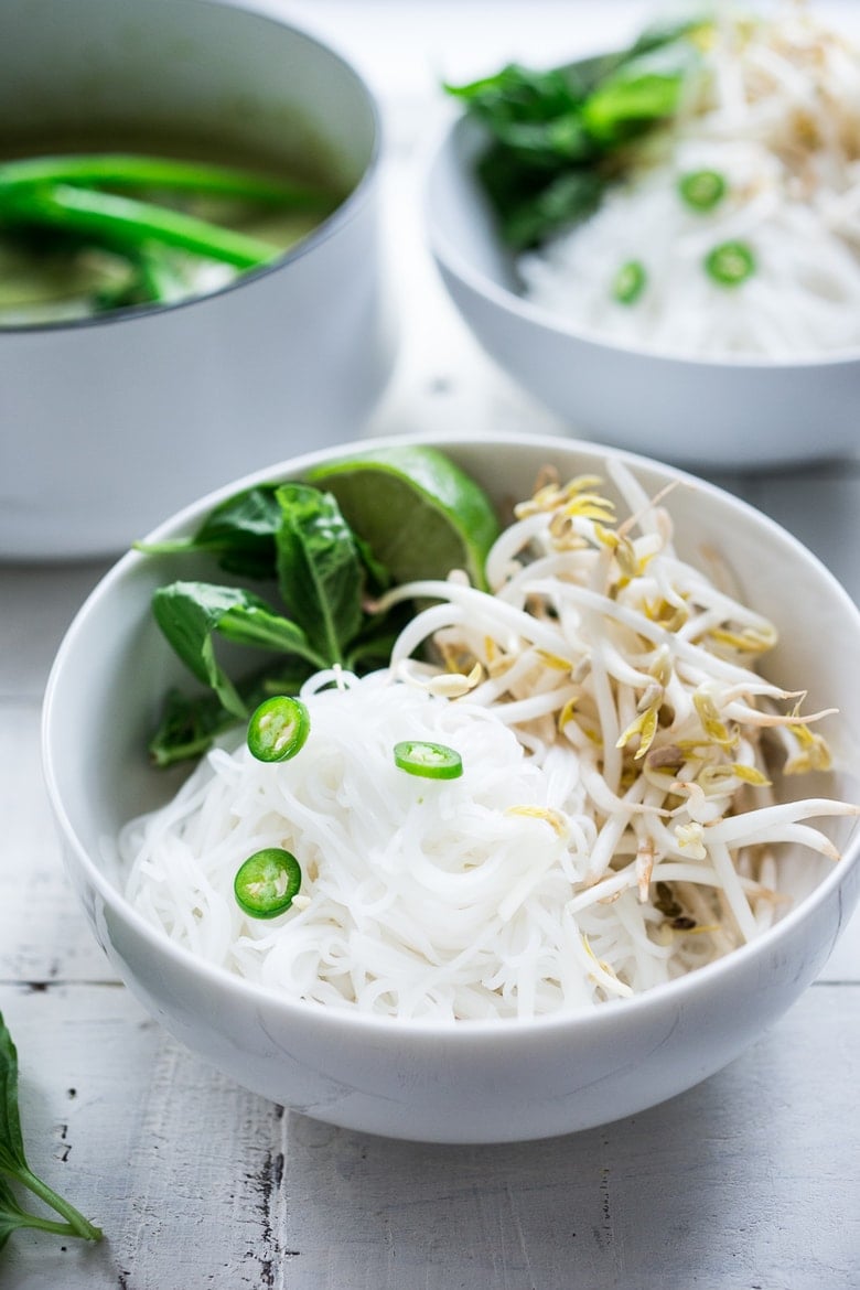 Bone-warming, Thai Green Curry Noodle Soup - with broccolini and and your choice of tofu or chicken. | www.feastingathome.com 