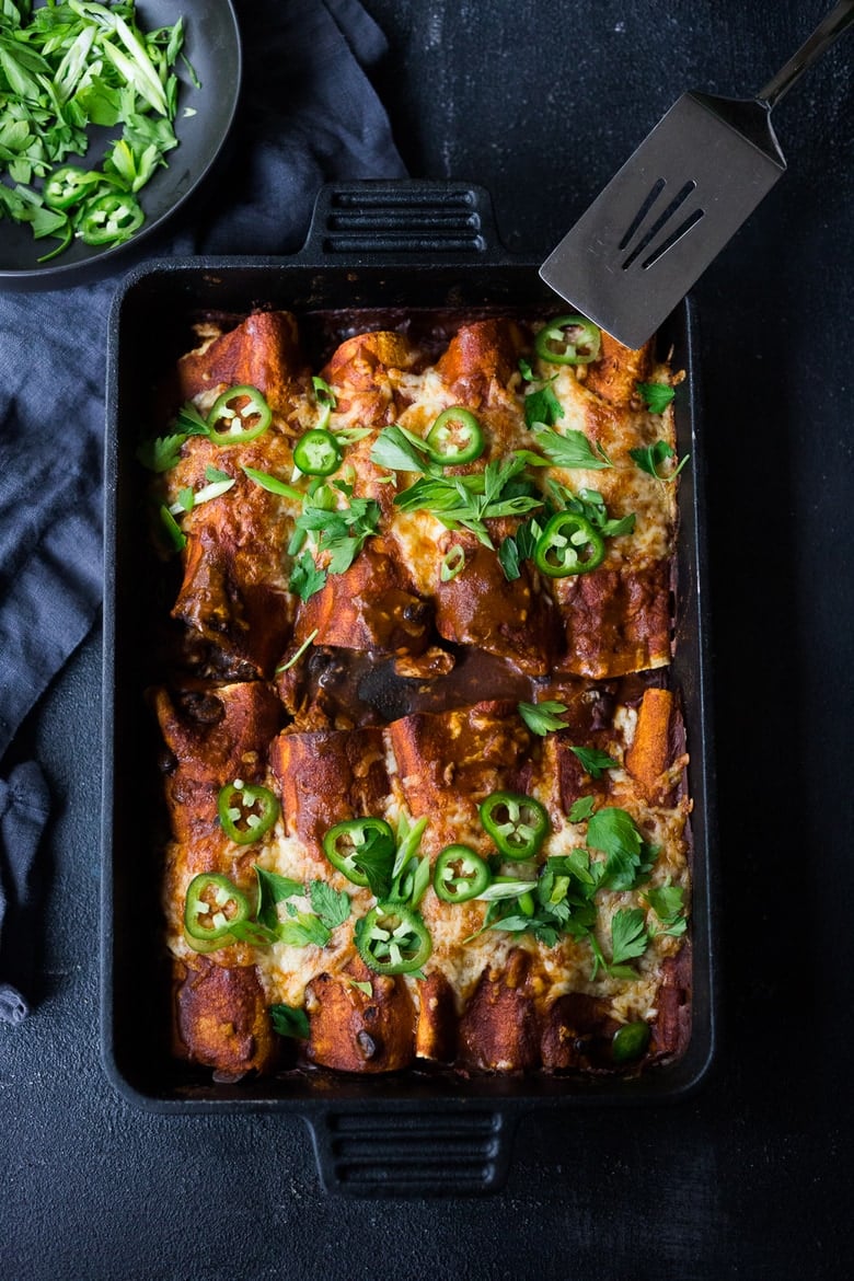 These Turkey Enchiladas with black beans are so hearty and flavorful! Make them with leftover Thanksgiving turkey and our  5-minute Homemade Enchilada Sauce. A tasty easy meal that can be eaten now, or frozen for later! 