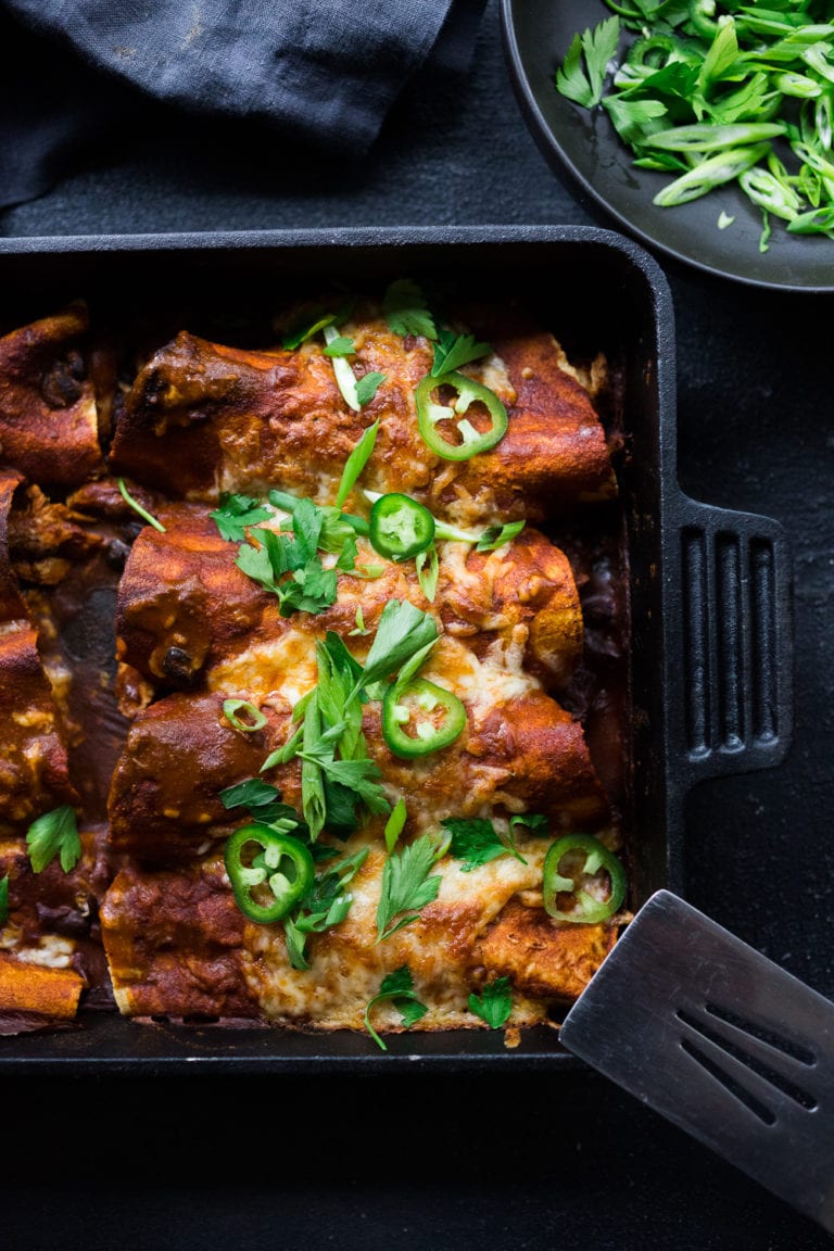 These Turkey Enchiladas with black beans are so hearty and flavorful! Make them with leftover Thanksgiving turkey and our  5-minute Homemade Enchilada Sauce. A tasty easy meal that can be eaten now, or frozen for later! 