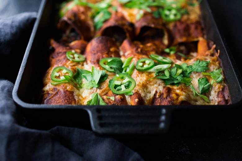 A simple delicious recipe for Chicken Enchiladas (or sub turkey!) with 5-minute Homemade Enchilada Sauce. A great way to use up leftover rotisserie chicken or Thanksgiving turkey. #chickenenchiladas #turkey #enchiladas 