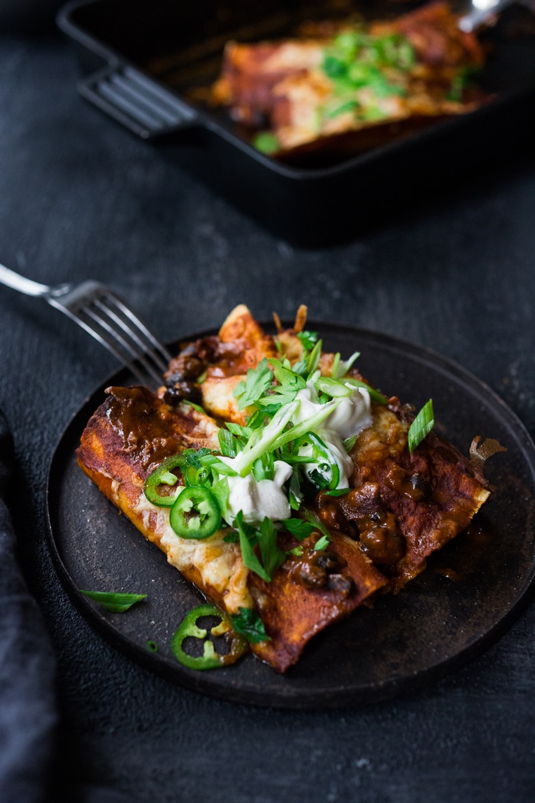 These Turkey Enchiladas with black beans are so hearty and flavorful! Make them with leftover Thanksgiving turkey and our  5-minute Homemade Enchilada Sauce. A tasty easy meal that can be eaten now, or frozen for later! 