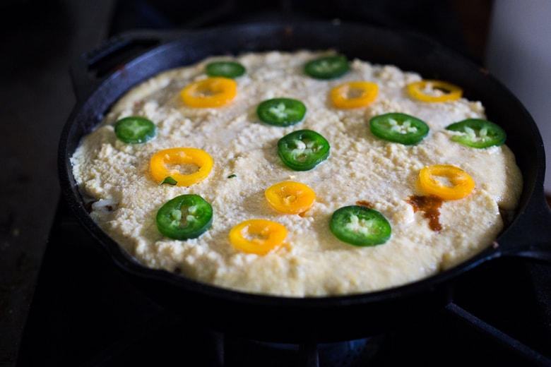 Simple Delicious Tamale Pie with your choice of ground turkey, beef or veggie meat with seasonal veggies, topped with a delicious cornbread crust. | www.feastingathome.com 