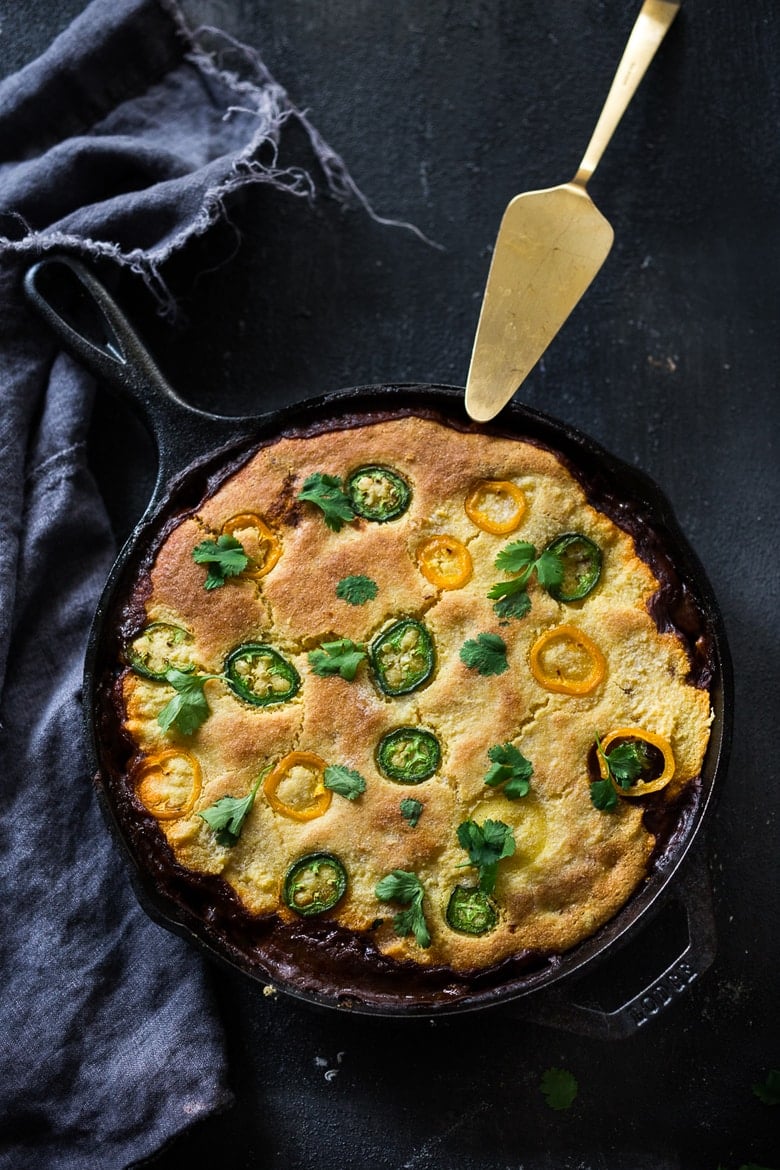 Simple Delicious Tamale Pie with your choice of ground turkey, beef or veggie meat with seasonal veggies, topped with a delicious cornbread crust. | www.feastingathome.com 