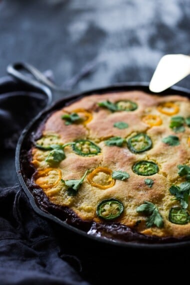 Simple Delicious Tamale Pie with your choice of ground turkey, beef or veggie meat with seasonal veggies, topped with a delicious cornbread crust. | www.feastingathome.com