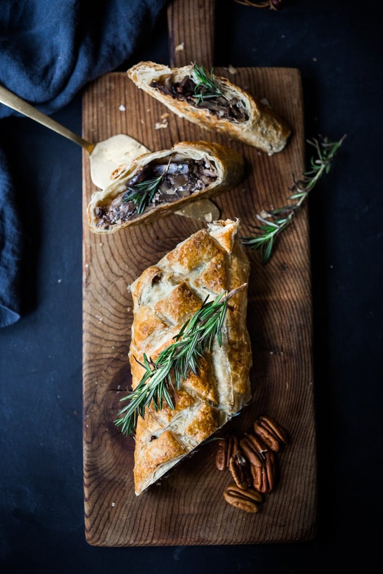 Mushroom Wellington with Rosemary and Pecans- a simple, elegant vegan main dish, that can be made ahead, perfect for Thanksgiving or Christmas! | www.feastingathome.com #mushroomwellington #vegan #thanksgivingrecipevegan #veganmain #veganthanksgiving #veganchristmas #veganmaindish #veganrecipe