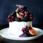 Simple, beautiful Brie Cake topped with fresh berries, figs and grapes, drizzled with honey and served with seeded crackers - an easy, festive appetizer or dessert, perfect for celebrations and gatherings. | www.feastingathome.com