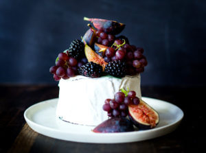 Simple, beautiful Brie Cake topped with fresh berries, figs and grapes, drizzled with honey and served with seeded crackers -  an easy, festive appetizer or dessert, perfect for celebrations and gatherings.  | www.feastingathome.com