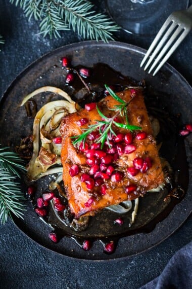 This Pomegranate Salmon recipe is so festive and delicious! Inspired by the flavors of Morocco, it is very easy to make, and worthy of your holiday table.