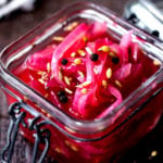 The BEST recipe for Pickled Red Onions with whole spices- that can be made in 15 minutes flat! Simple and easy with amazing flavor! #pickledredonions #pickledonions #easy