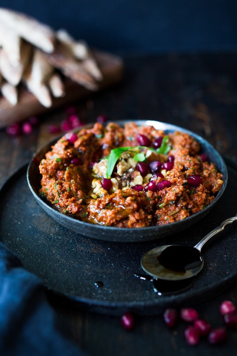 How to make Muhammara Dip - a flavorful Middle Eastern appetizer made with roasted peppers and walnuts. A delicious dip to serve with veggies or pita bread! #Muhammara #muhammaradip 