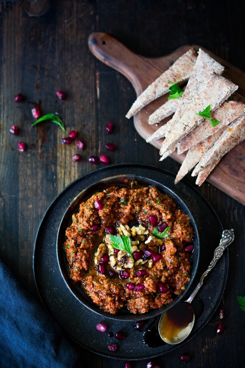 How to make Muhammara Dip - a flavorful Middle Eastern appetizer made with roasted peppers and walnuts. A delicious dip to serve with veggies or pita bread! #Muhammara #muhammaradip 