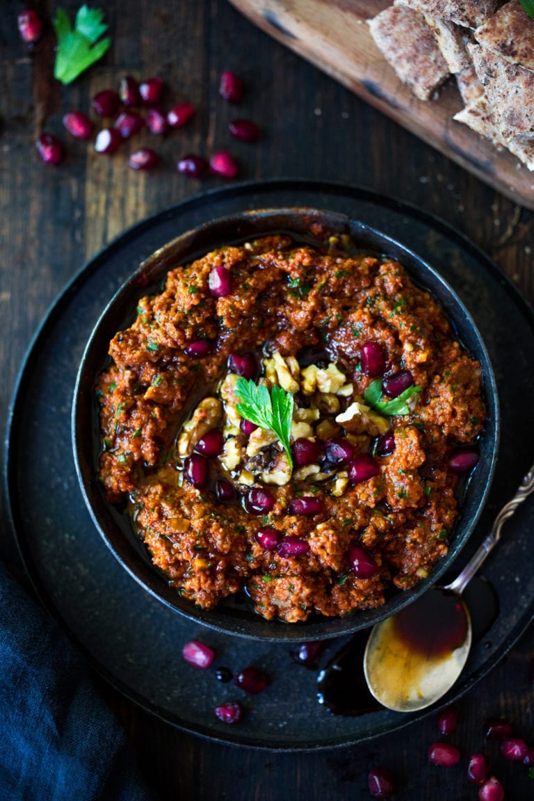 Muhummara Dip - a simple flavorful Middle Eastern Roasted Pepper & Walnut Dip that can be made ahead in food processor. Perfect for parties and gatherings, serve with toasted pita or crackers. | www.feastingathome.com